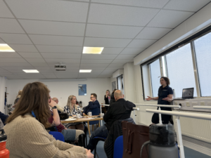 Photo of a female physio speaking at a Limbless Association lunch a learn session